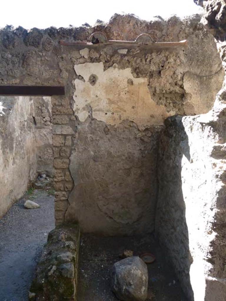 I.10.6 Pompeii. September 2015. Looking west through doorway of small room to east of workshop, with remaining bird wall painting. 
