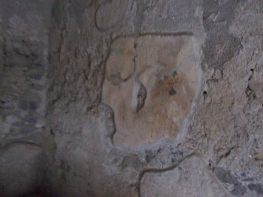 I.10.16 Pompeii. March 2009. L-shaped Kitchen, looking south along west wall at site of lararium?.  The lararium  had a painting with garlands, possibly two Lares and a Genius and Camillus group. See Frhlich, T., 1991. Lararien und Fassadenbilder in den Vesuvstdten. Mainz: von Zabern. (p.255, L14).
See Giacobello, F., 2008. Larari Pompeiani: Iconografia e culto dei Lari in ambito domestico.  Milano: LED Edizioni.  (P.147).
