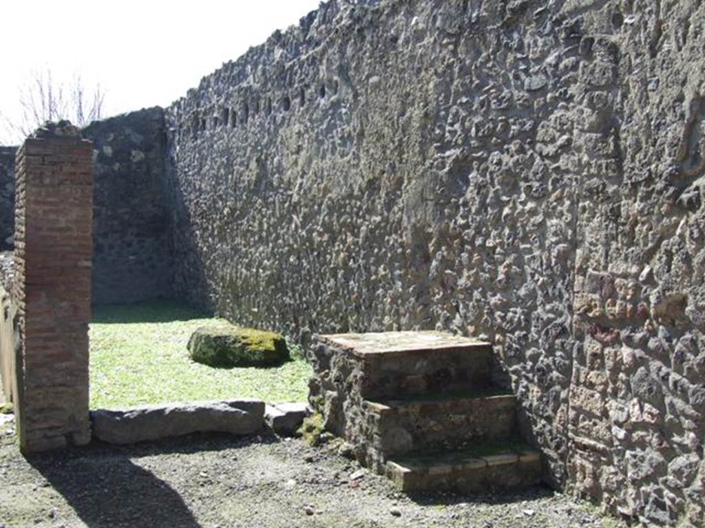 I.12.2 and I.12.1 Pompeii.  March 2009.  Room 11.  Steps to upper floor, against west wall.  Looking south towards room 12.