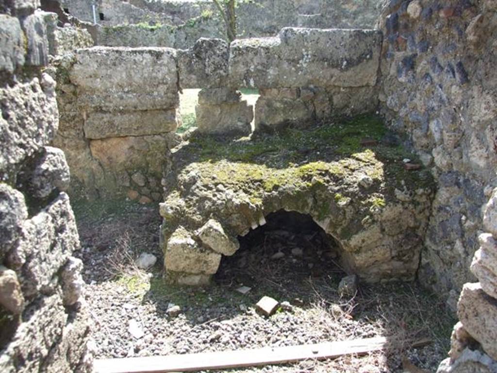 I.12.16 Pompeii.  March 2009.  Room 5.  Kitchen hearth. Looking south.