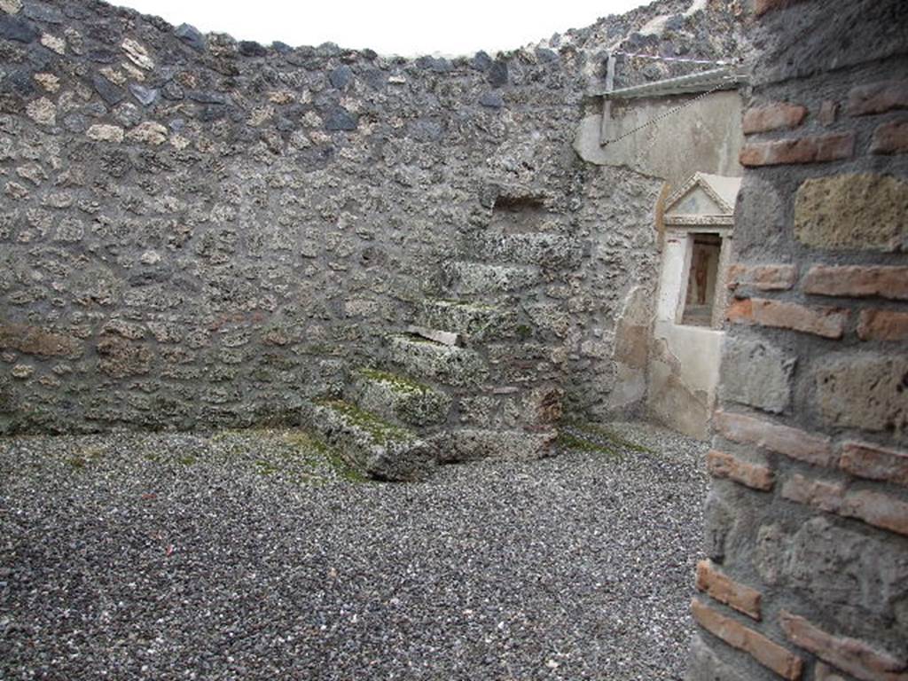 I.16.3 Pompeii. December 2006. West side of atrium, with six steps to upper floor.