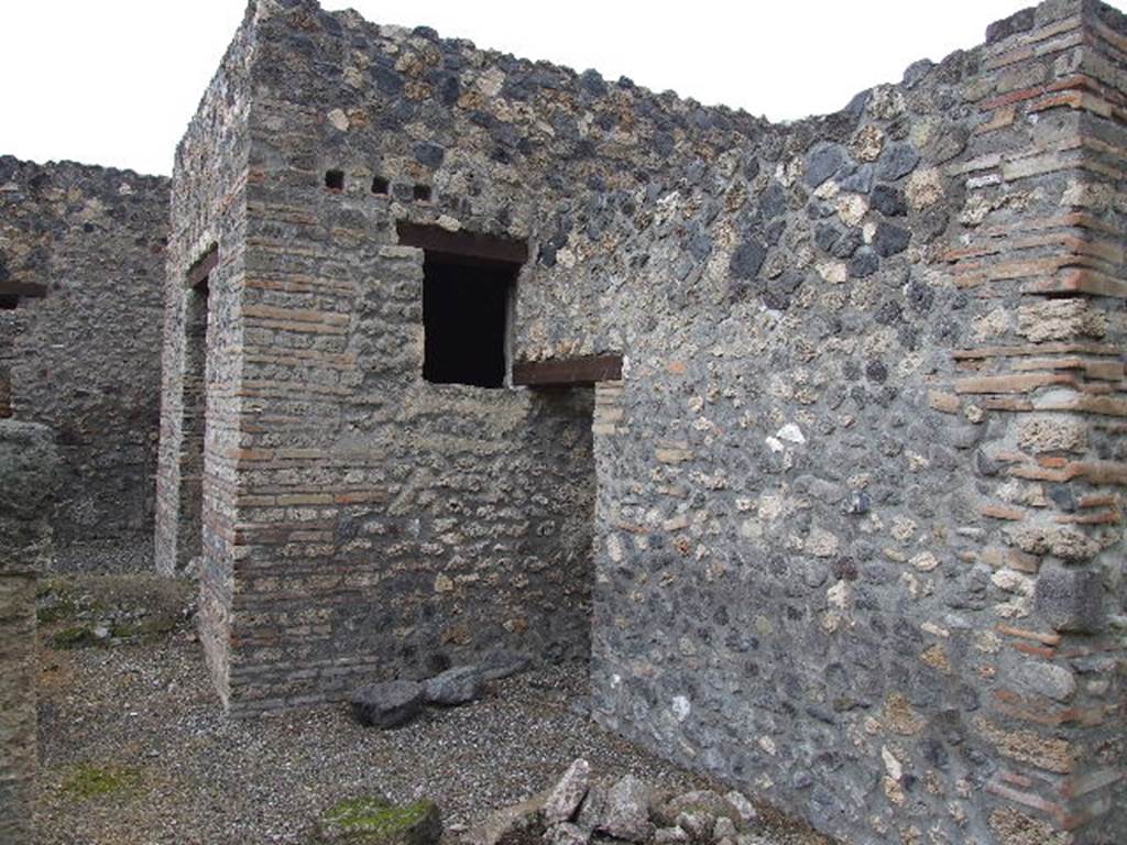 I.16.4 Pompeii. December 2006. Looking north from garden towards doorway to summer triclinium, and doorway to kitchen (centre).  The mound at the front of the doorway to the summer triclinium is the Sarno Canal which passes through the house
