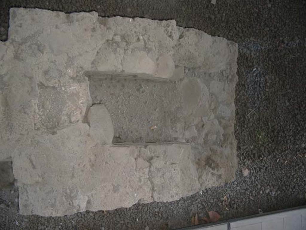 II.1.1 Pompeii.  May 2003. Looking down on hearth at south end of counter. 
Photo courtesy of Nicolas Monteix.
