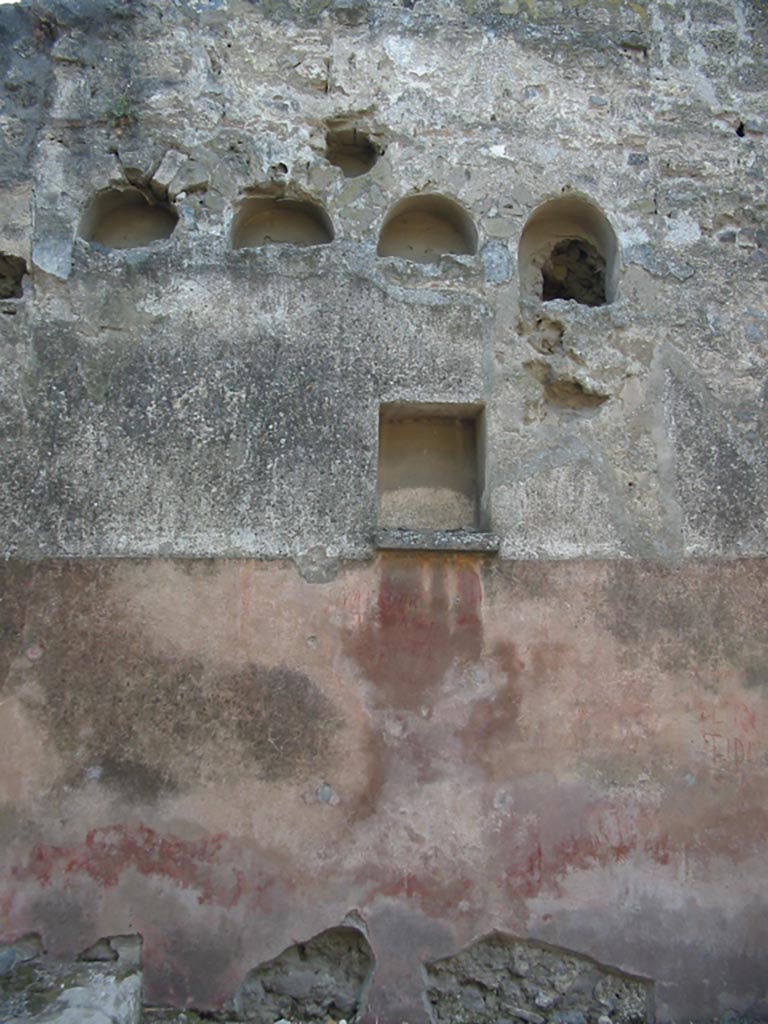 II.2.3 Pompeii. May 2003. 
West wall with remains of coloured zoccolo (dado) and niches. Photo courtesy of Nicolas Monteix.
