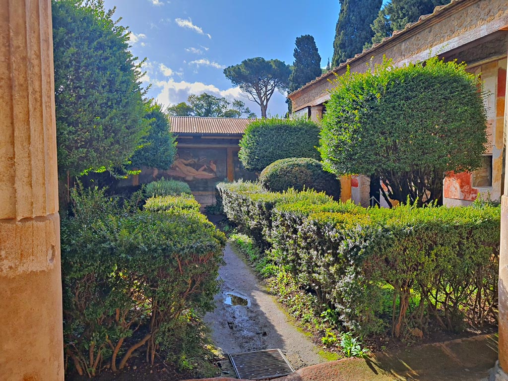 II.3.3 Pompeii. March 2024. Room 11, looking south across garden area from north portico. Photo courtesy of Giuseppe Ciaramella.