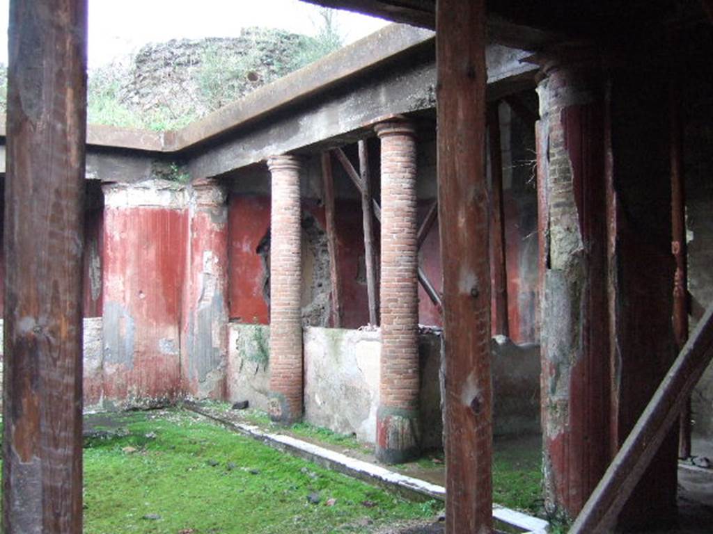 II.4.6 Pompeii. December 2006. Looking south along west side of portico, towards south-west corner.