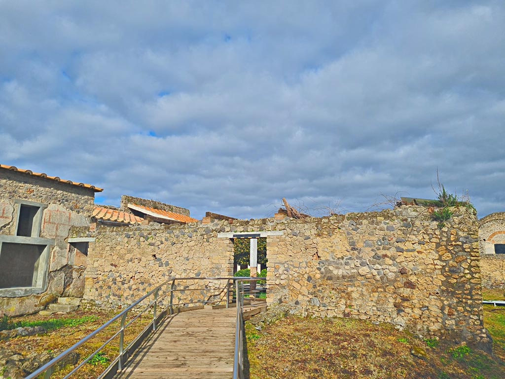 II.4.9 Pompeii. March 2024. Doorway leading north through south wall into peristyle/garden area. Photo courtesy of Giuseppe Ciaramella.