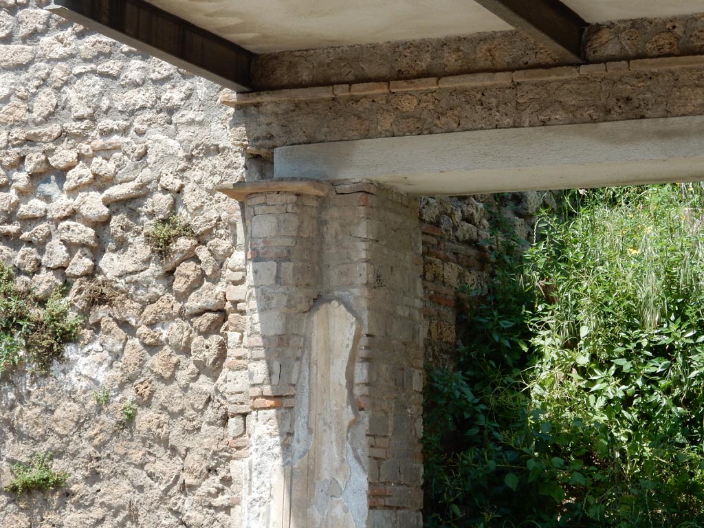 III.5.2 Pompeii. May 2016. Detail of west side of doorway. Photo courtesy of Buzz Ferebee.