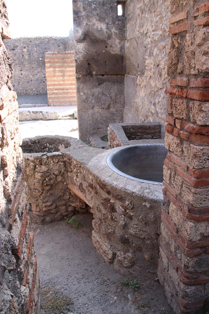 V.1.4 Pompeii. October 2023. 
Looking south from rear room through doorway to entrance room. Photo courtesy of Klaus Heese.
