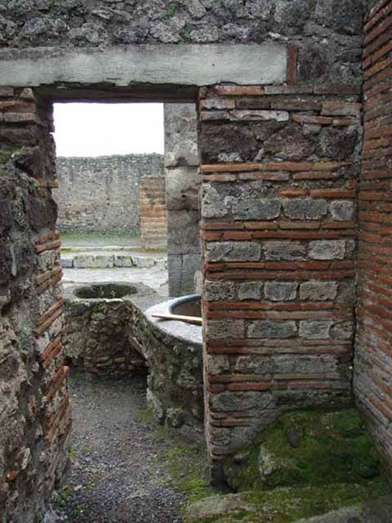 V.1.4 Pompeii. May 2010. Rear room, looking south through doorway to entrance on Via di Nola.