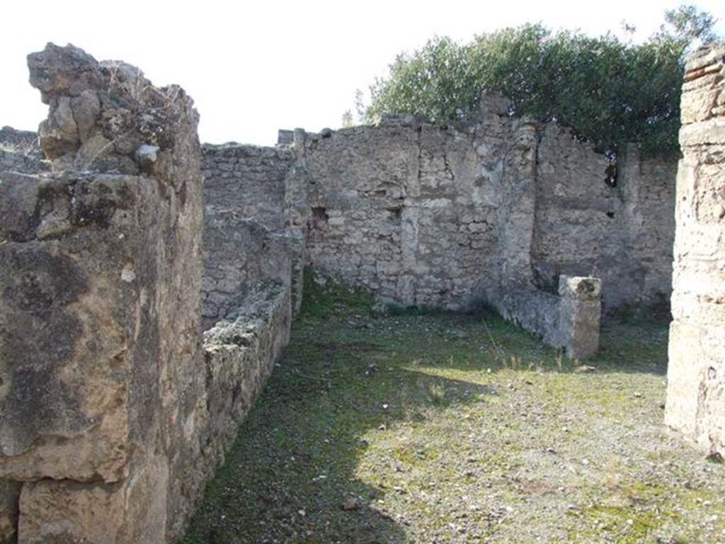 V.2.7 Pompeii. December 2007. 
Room 10, looking west along rear window of triclinium/tablinum, on left, towards a living room, overlooking the garden area, on right.
In the south-west corner, a pile of lime was found.

