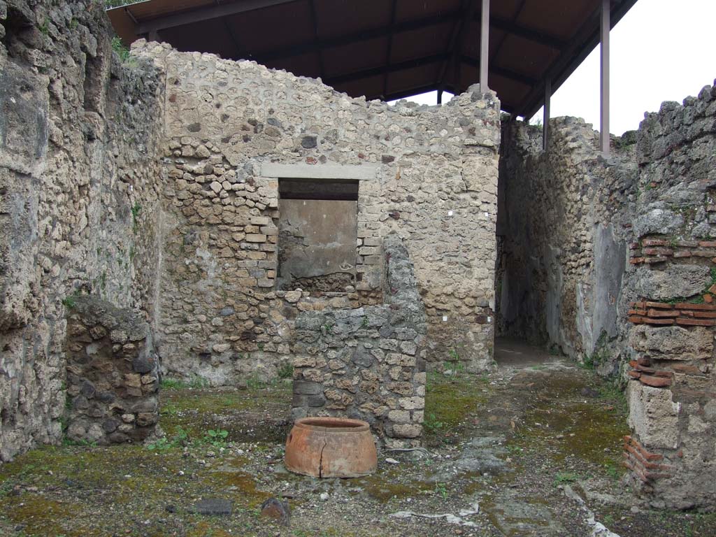 V.3.6 Pompeii. May 2010. Looking north across shop room, to small room at rear.