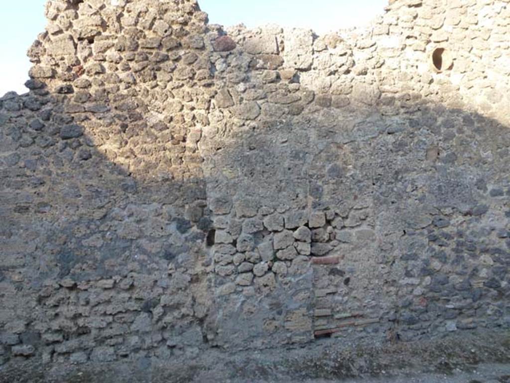 V.4.1 Pompeii. June 2012.  Looking east in Vicolo di M L Frontone towards side wall. Photo courtesy of Michael Binns.
