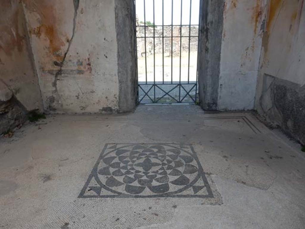 VI.1.6 Pompeii. May 2017. Looking east across flooring towards doorway in east wall to atrium of VI.1.7. Photo courtesy of Buzz Ferebee.
