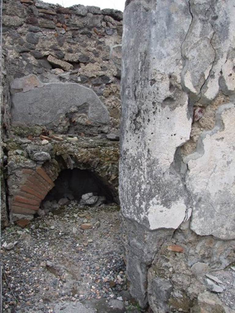 VI.2.10 Pompeii. December 2007. Looking north from doorway towards hearth in kitchen.