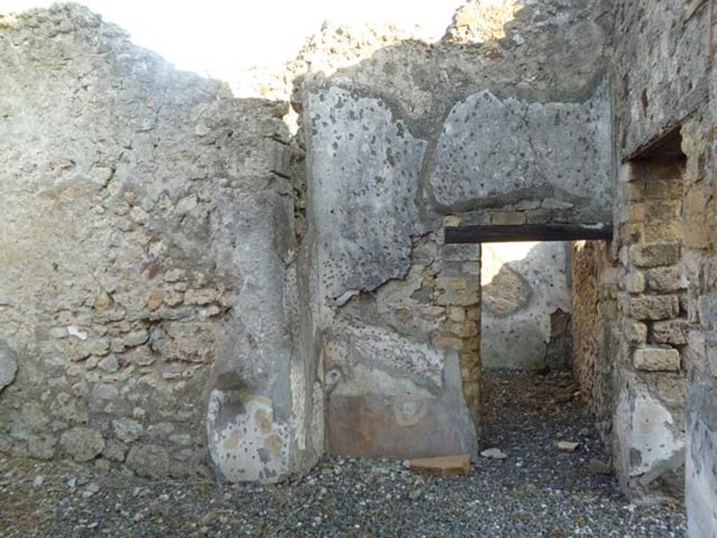 VI.7.1 Pompeii. May 2011. South wall with doorway to small room or storeroom.