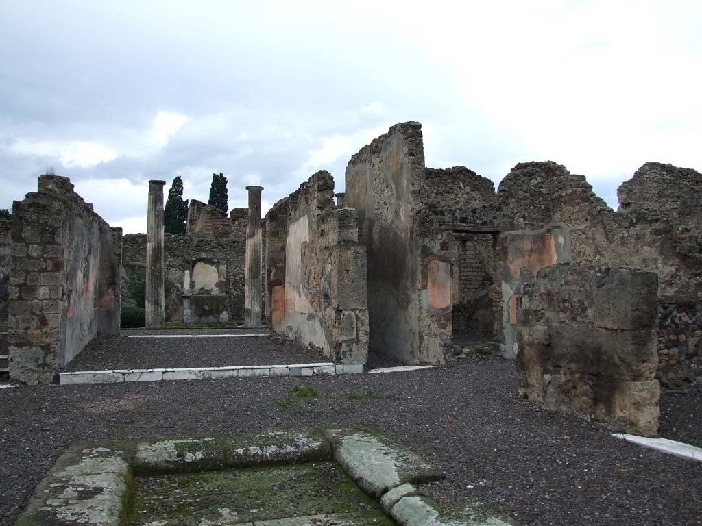 VI.7.20 Pompeii. December 2006. Looking north-west across atrium towards tablinum and corridor to rear.