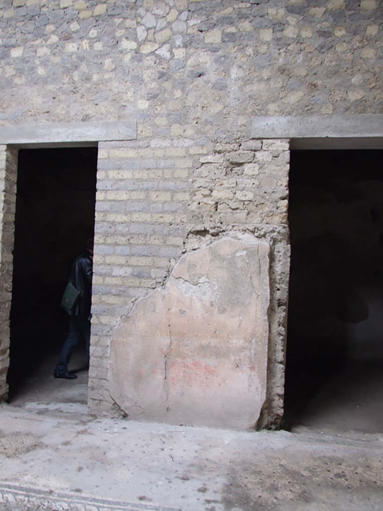 VI.8.5 Pompeii. March 2009. Wall between rooms 8 and 9 on west side of atrium: 
One of the six panels, each more than 4-foot-high, that used to adorn the walls of the atrium. 
Possibly the site of Thetis bringing arms across the sea to Achilles. 
The fragment that showed a Triton, two figures riding on a sea horse, and a Cupid on a dolphin, is now entirely faded.
See Mau, A., 1907, translated by Kelsey F. W. Pompeii: Its Life and Art. New York: Macmillan. (p.316).
