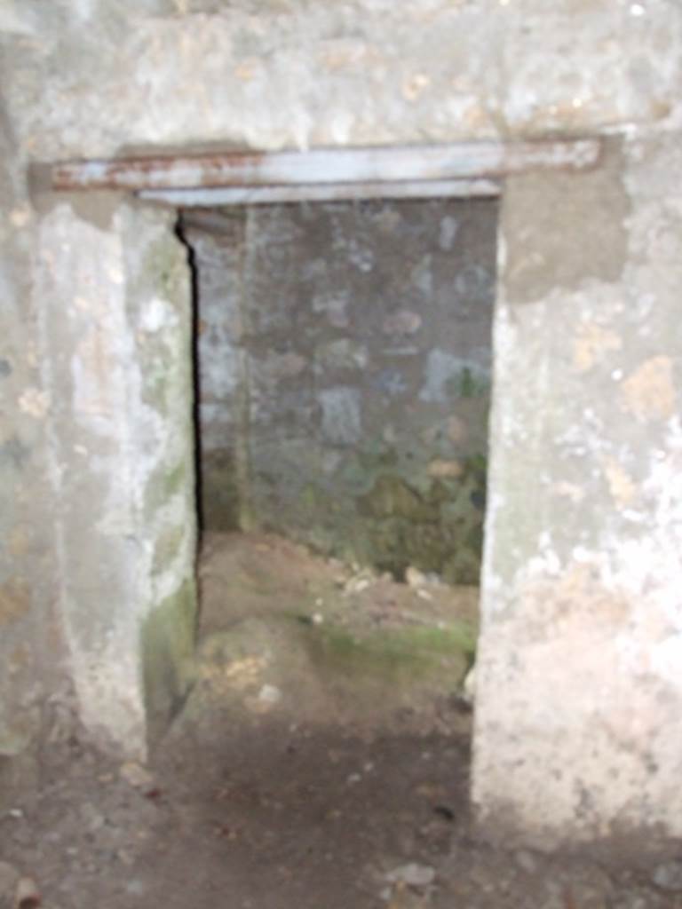 VI.9.10 Pompeii. March 2009. Looking east from second underground room, through doorway into corridor/passageway.