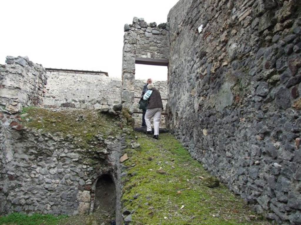 VI.9.10 Pompeii. March 2009. Entrance corridor/ramp, looking east to Vicolo del Fauno.