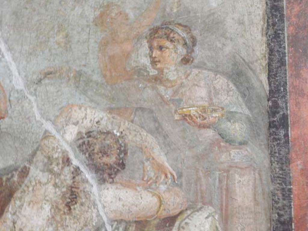 VI.15.1 Pompeii. May 2017. Hypnos (the god of sleep) with golden dish in his hand watching over Ariadne, detail of central painting from south wall. Photo courtesy of Buzz Ferebee.
