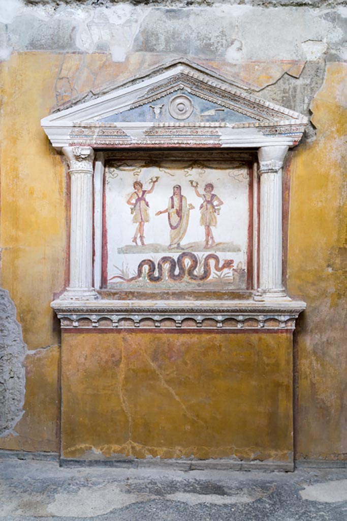 VI.15.1 Pompeii. March 2023. 
Household lararium on west wall in service area. Photo courtesy of Johannes Eber.
