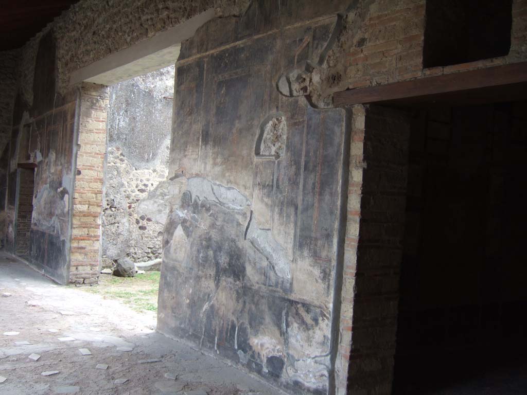 VI.16.7 Pompeii. May 2006. Doorways to rooms Q, O and R in west wall of room F, west portico. Looking south-west.