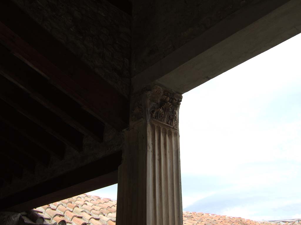 VI.16.7 Pompeii. May 2006. Room F, west portico. Pilaster and capital outside room O.