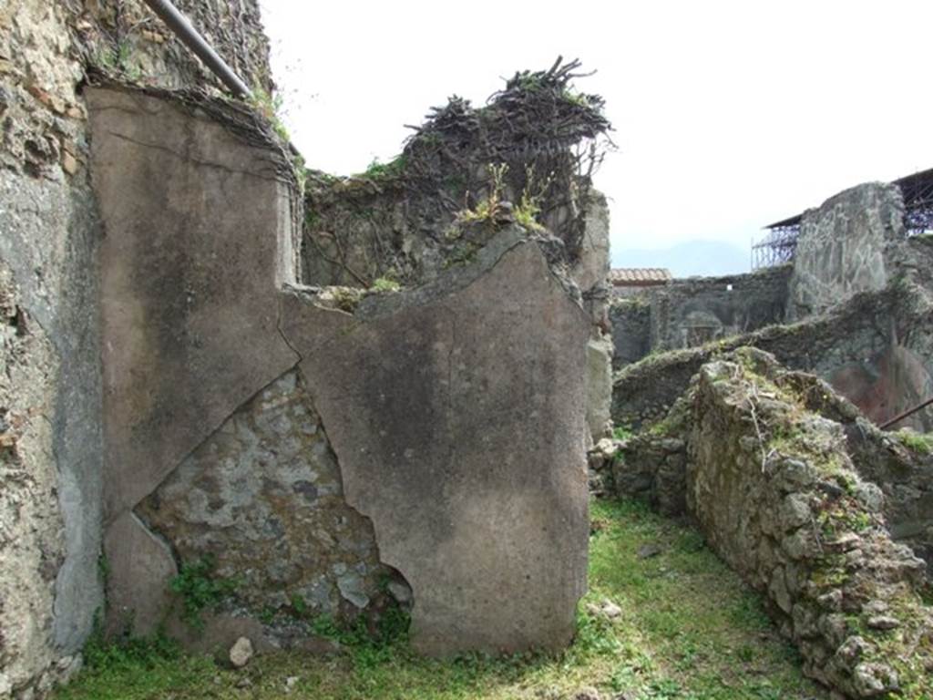 VI.16.29 Pompeii. March 2009. Room L, garden area, looking south to south wall with window, and doorway to room M. According to NdS, the window in the west wall was very wide and opened into room N. The window would have had a wooden windowsill and jambs.