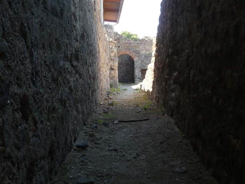 VII.1.8 Pompeii. May 2012. Corridor running south along rear of VII.1.52 to VII.1.58 on right.  Photo courtesy of Buzz Ferebee.
