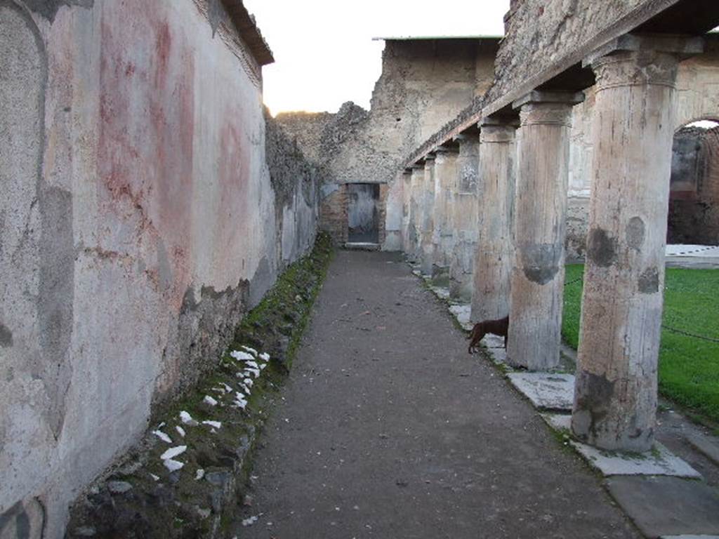 VII.1.8 Pompeii . December 2006. Looking west along south portico B towards doorway to destrictarium E.