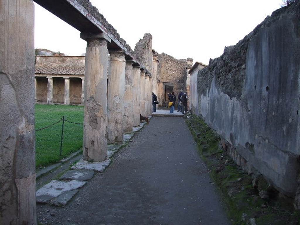 VII.1.8 Pompeii. December 2006. Looking across gymnasium C to rooms R and Q and portico B on north side.