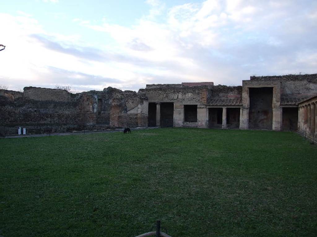 VII.1.8 Pompeii. December 2006. Looking across gymnasium C to rooms R and Q and portico B on north side.