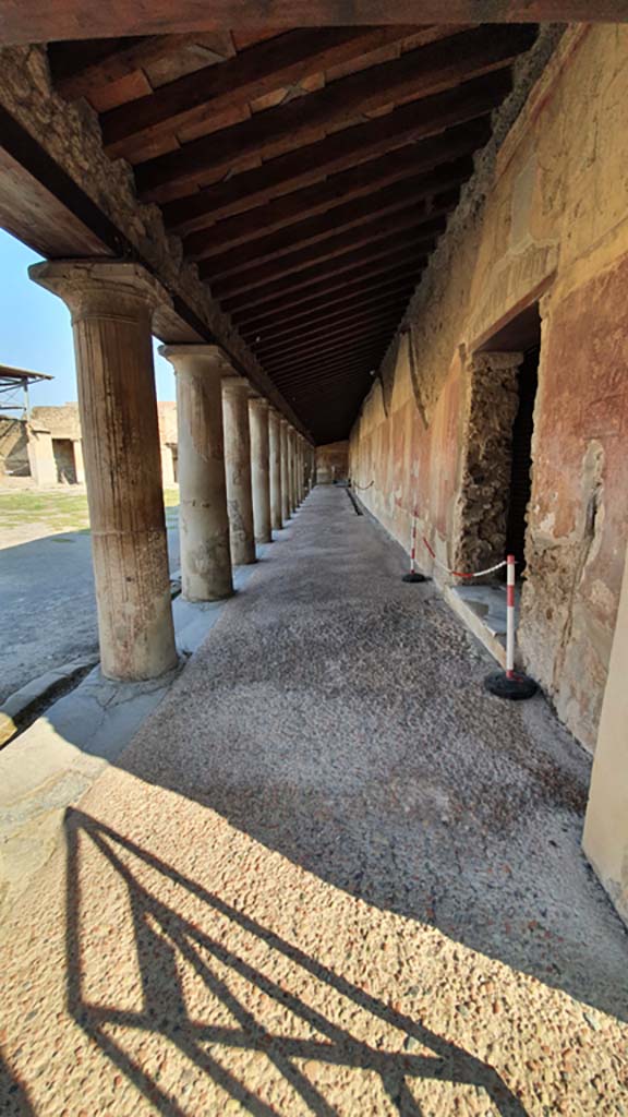 VII.1.8 Pompeii. October 2022. 
Looking north in corridor on east side of Portico B. Photo courtesy of Klaus Heese.
