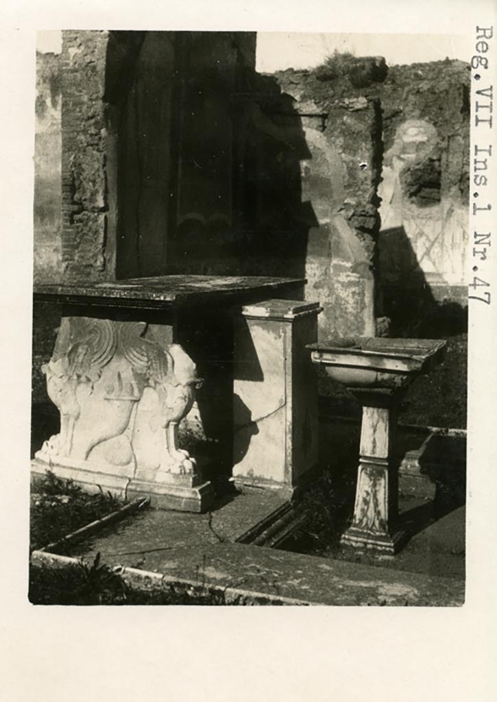 VI.1.25 Pompeii, but shown as VII.1.47 on photo. Pre-1937-39. 
Atrium 24. South side of table near impluvium, with podium. Looking north.
Photo courtesy of American Academy in Rome, Photographic Archive. Warsher collection no. 1510.
