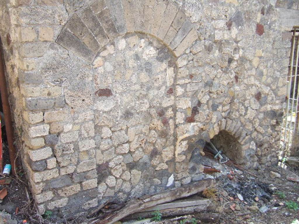 VII.3.28 Pompeii. May 2006 Blocked doorway in east wall, this used to go under stairway through to VII.3.26
