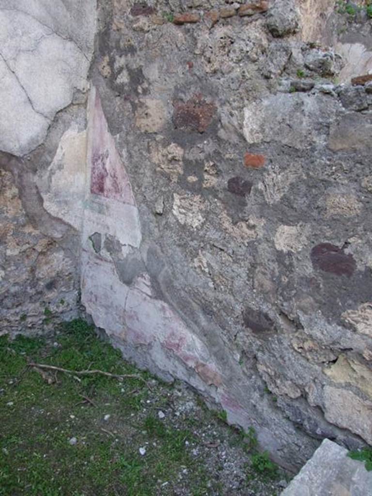 VII.4.57 Pompeii. March 2009. 
Room 9, north wall of ala with remaining painted decoration in north-west corner, similar to description from west wall.

