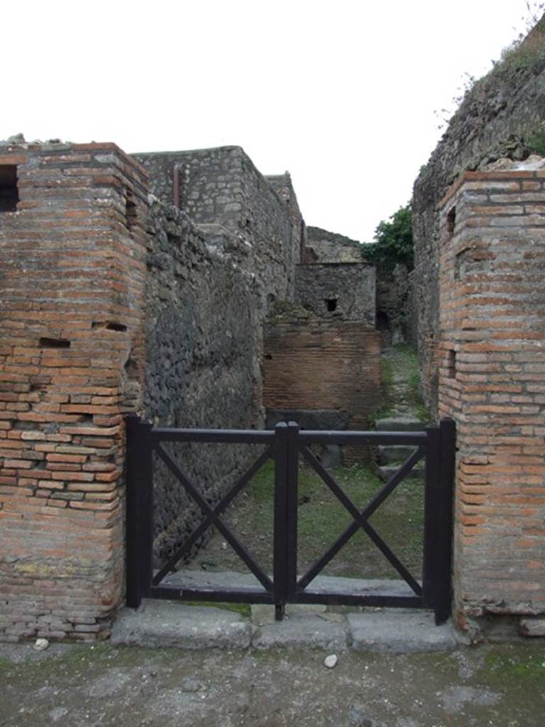VII.5.7 Pompeii.  Entrance to Forum Baths.  May 2005.  Entrance.
Found in February 1824 on the second pilaster of bricks…..(on the right), painted in red were –
M(arcum)  [V]esonium
Marcellum  [     [CIL IV 273]
M(arcum)  Cerrinium  [V]a[tia]m
aed(ilem)  saccari  rog(ant)       [CIL IV 274]
A(uli)  Suetti  Cer[ti  familia  gladiatorial  pugnabit(?)     CIL IV 1191 
Also found between VII.5.7 and 8 in July 1824 was –
M(arcum)  C(errinium)  V(atiam)  v(irum)  b(onum)  aed(ilem)  o(ro)  v(os)  f(aciatis)  Colepius
rog(at)    [CIL IV 246]
See Pagano, M. and Prisciandaro, R., 2006. Studio sulle provenienze degli oggetti rinvenuti negli scavi borbonici del regno di Napoli.  Naples : Nicola Longobardi.  (p.128 and p.130)
According to Della Corte, the noble Colepius [CIL IV 246 above, and Note 1 on p.117] was not well-known outside of Pompeii. He thought that probably the family house was on the Via degli Augustali, because of the other similar recommendations found there.
See Della Corte, M., 1965.  Case ed Abitanti di Pompei. Napoli: Fausto Fiorentino. (p.116-7)
