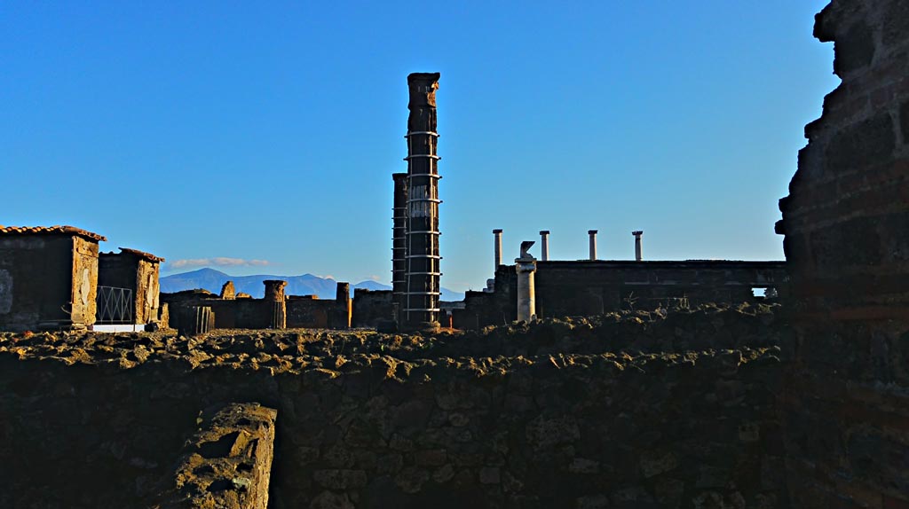 VII.7.2 Pompeii. December 2019.
Looking east towards Temple of Venus, cross two boundary walls with a space between. 
Photo courtesy of Giuseppe Ciaramella.
At some stage in its early life, the wall between the Temple and the Casa di Trittolemo was rebuilt.
According to Cooley – an inscription related to changes either in the sanctuaries’ relationship with the Forum, to the east, or with private houses to the west, gave legal permission for the blocking off of light from the spaces adjacent to the sanctuary.
For the inscription -
Marcus Holconius Rufus, duumvir with judicial power for the third time and Gnaeus Egnatius Postumus, duumvir with judicial power for the second time, in accordance with the decree of the town councillors paid 3,000 sesterces for the right to block off light and saw to the building of a private wall belonging to the Colonia Veneria Cornelia as far as the roof.
See Cooley, A. and M.G.L., 2004. Pompeii: A Sourcebook. London: Routledge, (p.84-5, E1 – CIL X 787 = ILS 5915 (c. before 2 BC).
(See also VII.7.32).
