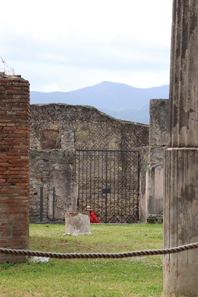 VII.7.13 Pompeii. May 2024. 
Looking south across atrium towards entrance doorway at VII.7.10. Photo courtesy of Klaus Heese.
