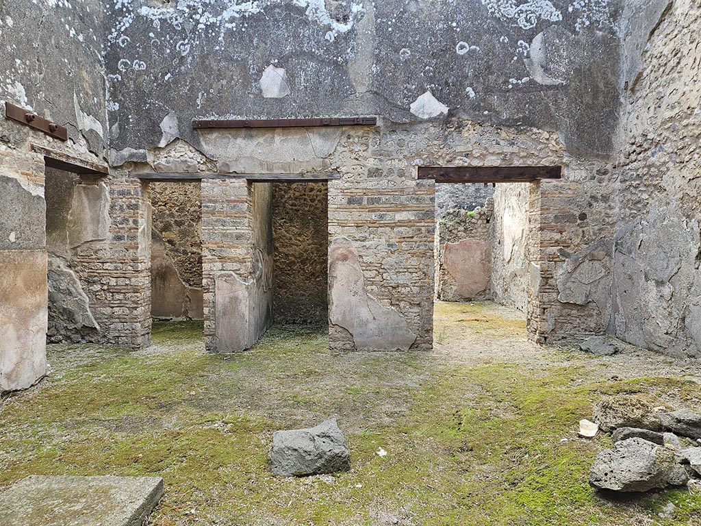 VII.11.11/14 Pompeii. November 2024. Room 8, atrium, doorways on south side of atrium. Photo courtesy of Annette Haug.