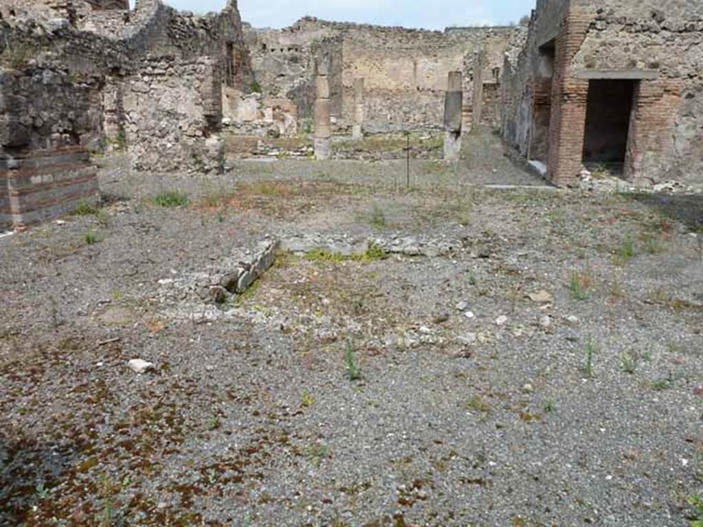 VII.13.4 Pompeii. May 2010. Looking north across atrium with remains of impluvium.