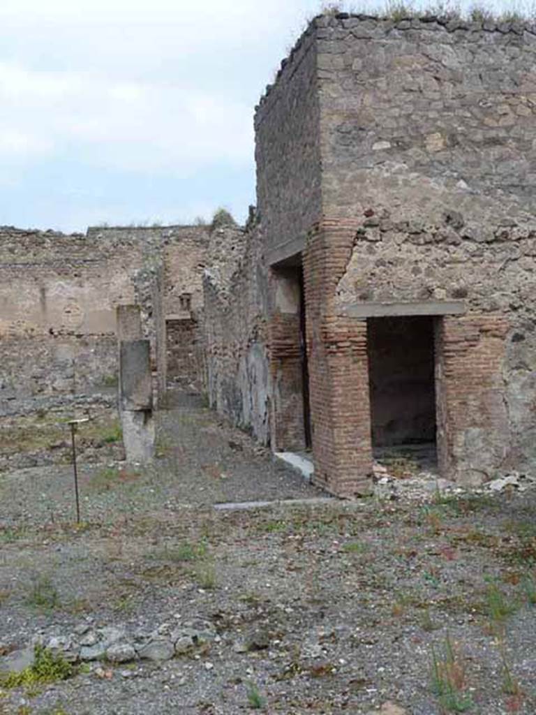 VII.13.4 Pompeii. May 2010. Two doorways of oecus on east side of peristyle.