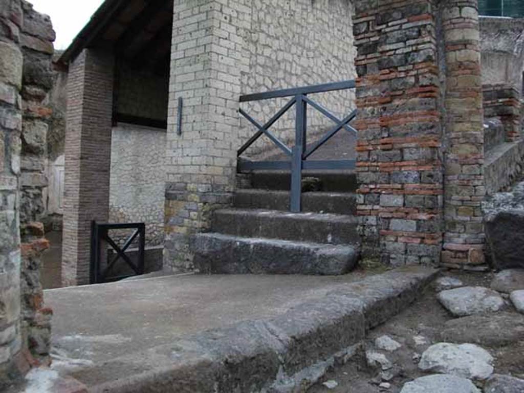 VII.16.a Pompeii. May 2010.  Upper steps that would have led east, under the exterior portico.  The entrance to corridor B can be seen on the left.
