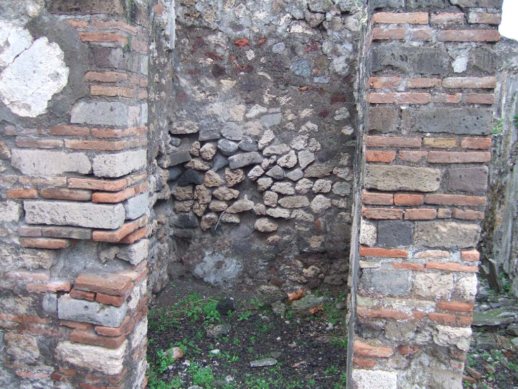 VIII.2.3 Pompeii. December 2005. Small room on north-west corner of the peristyle.  
According to Boyce, off the north-west corner of the peristyle opened a small room which Mazois and Fiorelli called the lararium.
See Boyce G. K., 1937. Corpus of the Lararia of Pompeii. Rome: MAAR 14. (p.74, no.342) 
