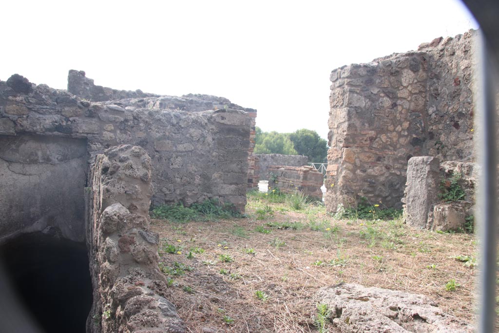 VIII.2.27 Pompeii. October 2023. Looking south across kitchen area towards doorway leading to atrium. Photo courtesy of Klaus Heese.