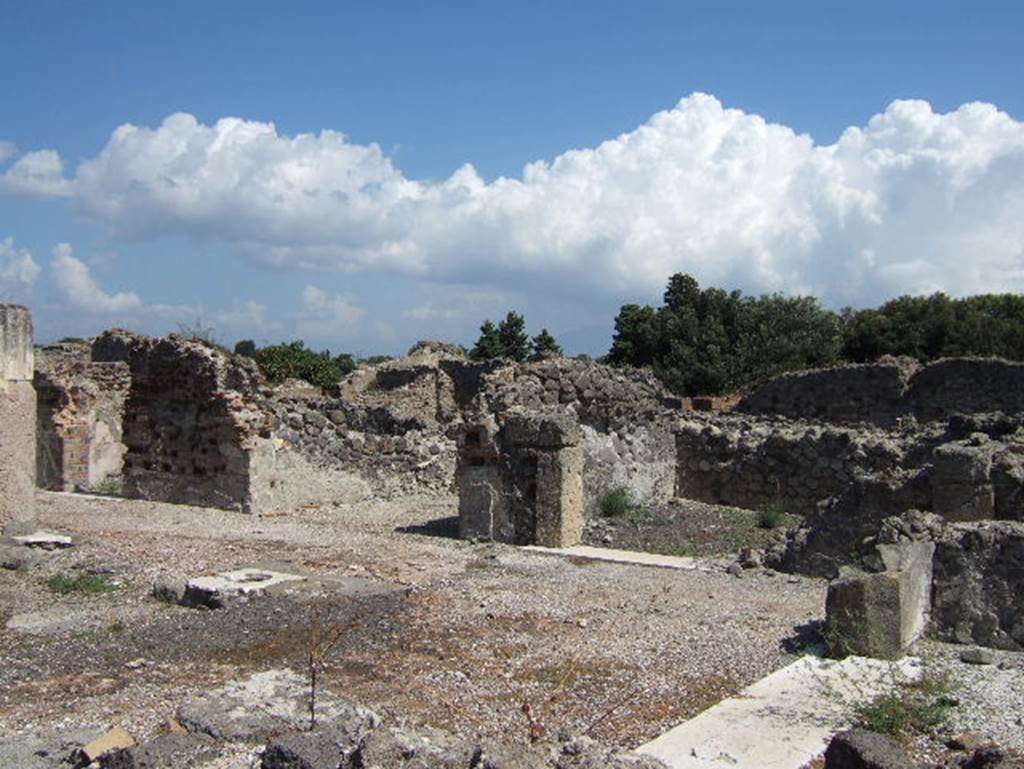 VIII.2.28 Pompeii. September 2005. Rooms on east side of atrium, cubiculum, east ala and another cubiculum. According to Richardson, in tetrastyle atria the alae are located in the centre of each side, and here they were originally framed with pilasters.
See Richardson, L., 1988. Pompeii: an Architectural History. Baltimore: John Hopkins University Press. (p.231-2).
