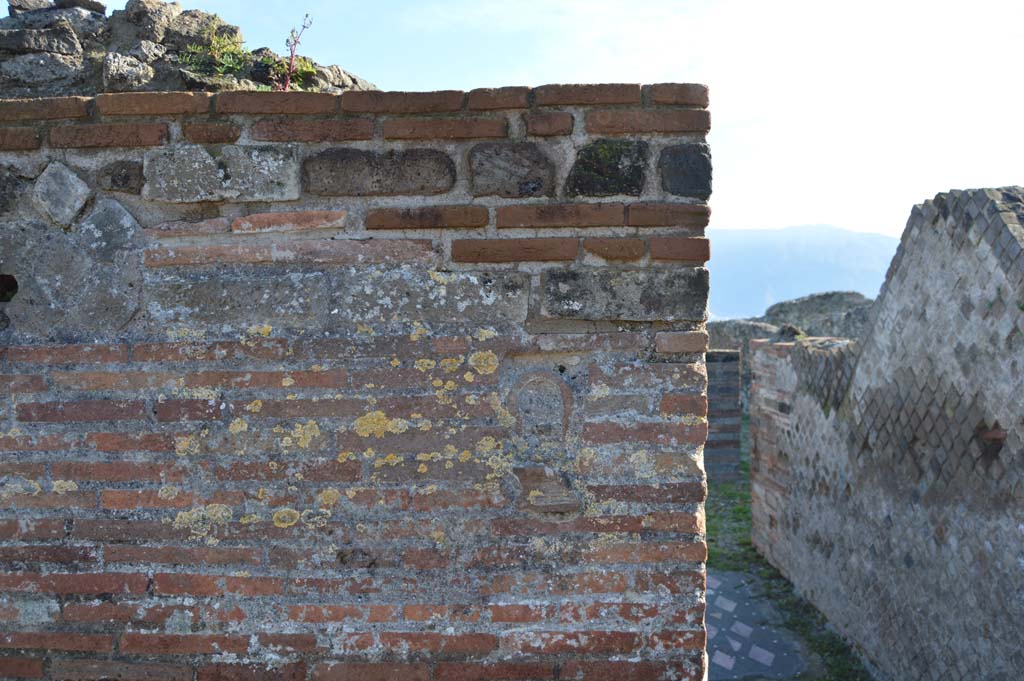 VIII.2.29 Pompeii. March 2018. 
Looking south to remains of mask/face on front wall on east side of entrance doorway, (see also VII.2.30 for more details of walls)
Foto Taylor Lauritsen, ERC Grant 681269 DÉCOR.

