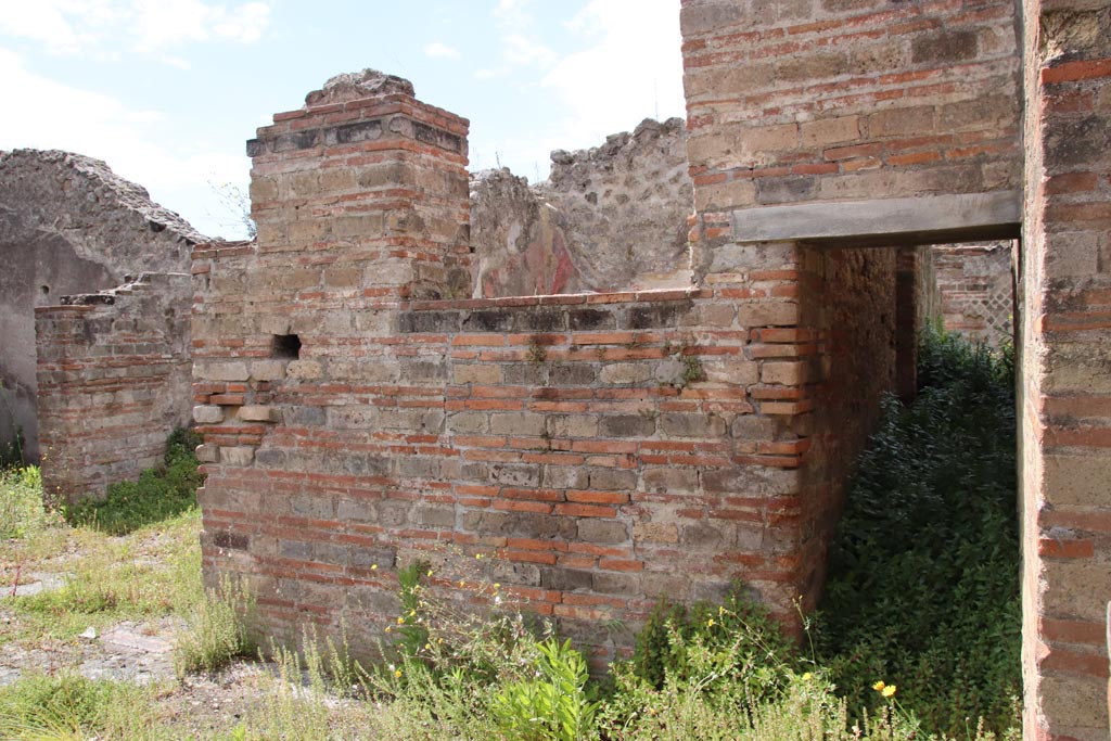 VIII.2.30 Pompeii. May 2024.  
North-west corner of atrium, with doorway to cubiculum, on left, on south side of open recess with steps into VIII.2.29.
On the right can be seen the doorway to the corridor in the west wall of the atrium. Photo courtesy of Klaus Heese.
