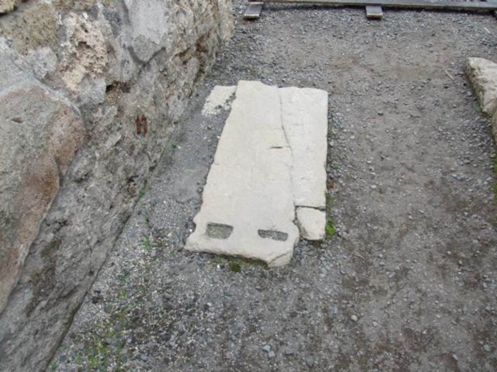 VIII.3.27 Pompeii.  December 2007.  Floor of fauces with marble door base.